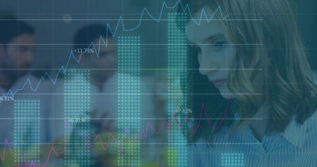 Studying woman in striped shirt analyzing bar, line graphs on glass partition in office, copy space. Data visualization, teamwork, analytics, corporate, innovation, digital, collaborationの写真素材