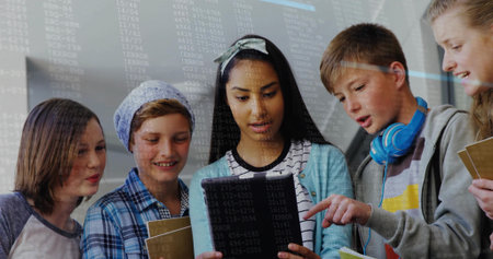 Collaborating five students coding on tablet in classroom, with notebooks and headphones. Education, teamwork, technology, innovation, youth, learning, digitalの写真素材