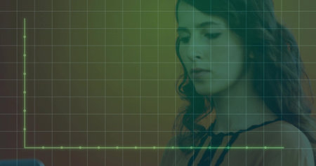 Woman clad in sleeveless blouse reviewing green chart grid overlay on tablet at desk, copy space. Businesswoman, data analysis, minimalistic, modern, technology, professional, productivityの写真素材