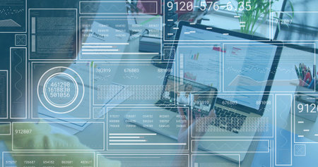Displaying open laptop showing charts at desk with HUD and team wearing business-casual. Dashboards, analytics, data, visualization, graphs, collaboration, officeの写真素材