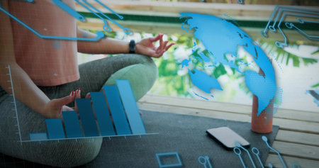 Sitting woman meditating on deck yoga mat in croptop pants, smartwatch-phone, plant, copy space....