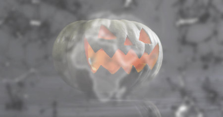 Glowing carved pumpkin emitting warm orange light in studio, with smoke and glossy reflection. Jackolantern, amber, candle, fog, reflective, eerie, moodyの写真素材