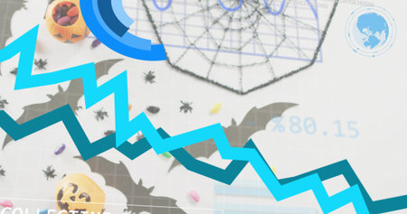 Displaying blue-teal jagged data overlay on craft mat with pumpkin bucket, candy, bats, spider web. Halloween, decor, tabletop, grid, visualization, graph, festiveの写真素材