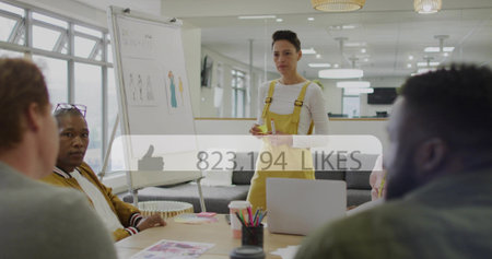 Presenting woman in yellow overalls sketching on flipchart at office, laptop mockups 823,194 LIKES. Presenter, team, meeting, design, collaboration, workspace, openplanの写真素材