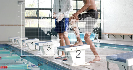 Crouching swimmer in dark trunks at block 2 by pool, coach in white shirt holding stopwatch. Platform, dive, training, athlete, lanes, water, daylightの写真素材
