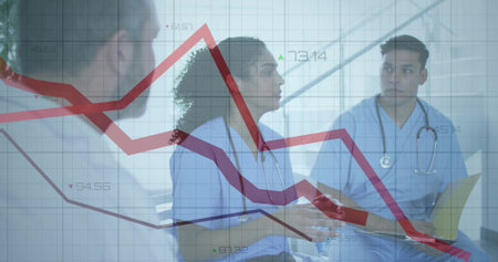 Talking clinician in scrubs with stethoscope gesturing and using tablet in clinic, chart overlay. Healthcare, teamwork, collaboration, hospital, meeting, analytics, dataの写真素材