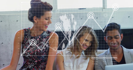 Collaborating team in office wear leaning on sofa in modern office lounge, laptop and data overlay. Colleagues, professionals, coworking, minimalist, industrial, workspace, visualizationの写真素材