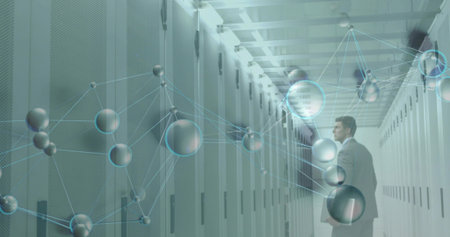 Inspecting man in gray suit standing by server racks in data center, network overlay, copy space....