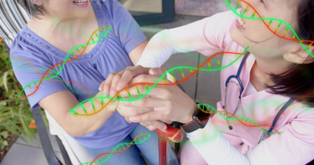 Helping senior, nurse in pink scrubs kneeling on porch, holding cane with stethoscope. Caregiving, eldercare, mobility, support, compassion, patio, healthcareの写真素材