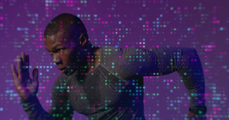 Sprinting athlete leaning in magenta studio, wearing longsleeve shirt and watch, with pixel overlay. Runner, neon, cyber, data, fitness, dynamic, wearableの写真素材