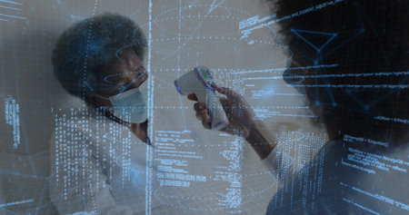 Pointing nurse in scrubs holding IR gun at senior, surgical masks, clear partition, in clinic, AR. Thermometer, overlay, holographic, biometric, analytics, monitoring, clinicalの写真素材