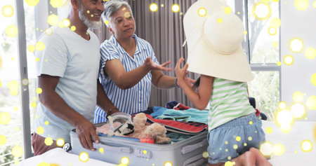 Packing family members wearing sun hat placing clothes into suitcase on bed with teddy bear. Group, relatives, vacation, luggage, room, daylight, windowsの写真素材