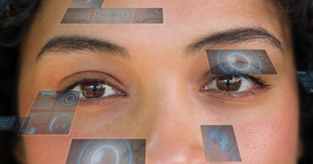Gazing adult woman in studio closeup, displaying holo tiles, circular HUD and corneal reflections....