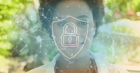 Posing woman wearing white blouse, gazing at camera in garden with shield padlock network overlay. Cybersecurity, privacy, encryption, security, portrait, calm, outdoorsの写真素材