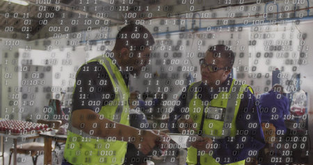 Reviewing forms, two men in hi-vis yellow vests examining tablet in hangar, with binary overlay....