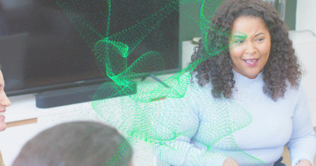 Speaking woman in blue sweater leading meeting in office with TV soundbar green overlay, copy space. Colleagues, business, modern, technology, boardroom, collaboration, communicationの写真素材