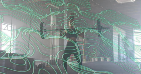 Standing woman in black gear adjusting hair in gym studio with mirror, plates and teal lines....