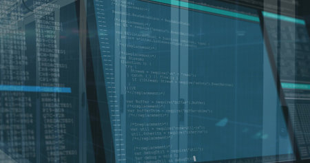 Displaying vertical monitor showing source code in control room, with glass panels and LED glow....
