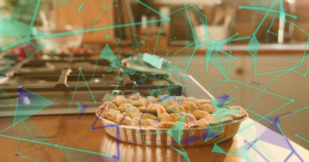 Displaying lattice pie in aluminum tart pan sitting on countertop near gas stove with teal overlay. Dessert, pastry, crust, baked, kitchen, warm, cozyの写真素材
