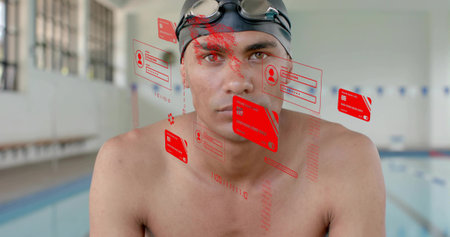 Standing bare-chested male swimmer wearing black swim cap and goggles at pool, with red holograms....