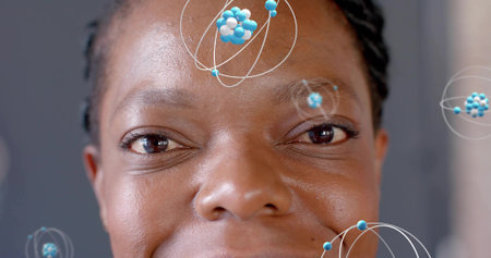 Showing African American woman with braids revealing skin texture in studio, with molecular orbits....