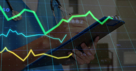 Writing on clipboard with pen, clinician in blue scrubs and stethoscope viewing overlays in clinic. Healthcare, professional, analytics, data, graphs, grid, visualizationの写真素材