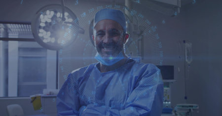 Standing male surgeon wearing blue surgical gown, crossing arms in OR, HUD glowing, surgical light. Physician, hospital, operating, holographic, overlay, monitor, clinicalの写真素材