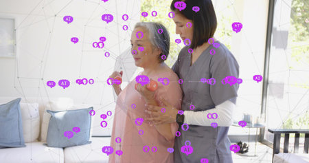 Holding woman in pink blouse using pink weights at home, carer gray-scrubbed assisting. Rehab, therapy, caregiver, dumbbells, livingroom, sunlit.の写真素材