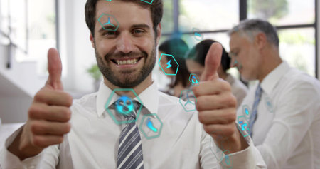 Man in shirt and tie giving thumbs up, smiling at camera in office, with hex overlay. Professional, collaboration, teamwork, modern, technology, daylight, workspaceの写真素材