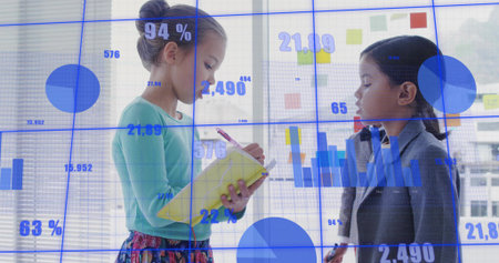 Writing kid mint holding yellow-notepad pencil at glass blue-data stickies, peer in blazer watching....
