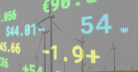 Displaying LED ticker overlay covering rural wind farm with 3-blade turbines, $ â¬ numbers on grid. Renewable, market, dataviz, analytics, digital, outdoor, meadowの写真素材