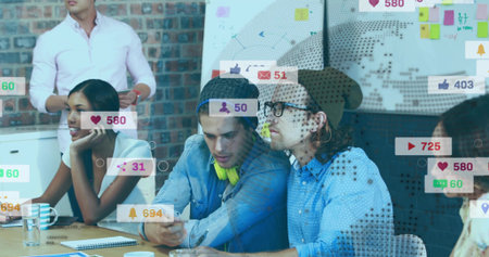 Discussing team of five in casual wear planning in office, with smartphone, whiteboard social icons. Colleagues, collaboration, brainstorming, marketing, design, modern, workspaceの写真素材