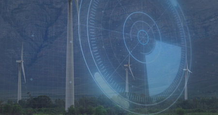 Rotating white wind turbines with three-bladed rotors occupying rural valley, showing blue HUD grid....