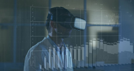 Exploring man in white collared shirt wearing VR headset manipulating holographic charts in dim lab....