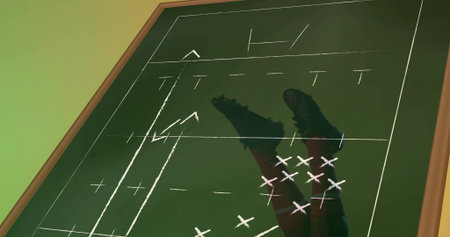Standing male player showing lower legs with maroon socks and cleats over chalkboard, wood frame....