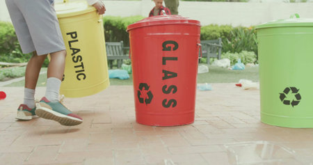 Featuring red GLASS bin centered in park, child lifting yellow PLASTIC bin wearing gray shorts....