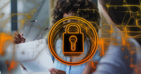 Reviewing documents, woman in blue top holding glasses in office, padlock overlay and circuit lines....