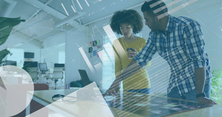 Coach tapping tablet and analyzing digital training metrics overlay on basketball courtの写真素材