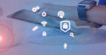 Right forearm-hand swiping tablet on desk in blue long-sleeve shirt, smartwatch showing fingerprint....