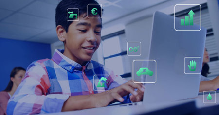 Typing teen male wearing plaid shirt working on silver laptop in classroom with green icons. Student, dataviz, sustainability, education, school, collaboration, technologyの写真素材