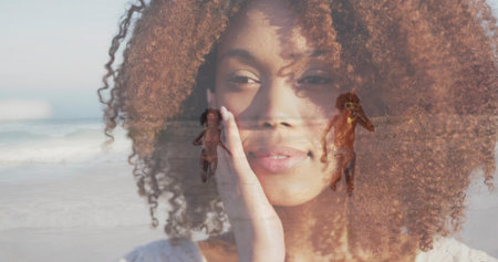 Touching cheek, woman with curly hair blending with seaside shoreline, children running in swimwear. Portrait, beach, doubleexposure, sunlit, outdoor, family, parenthoodの写真素材