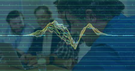 Leaning bearded man wearing blue jumper working on laptop at meeting table data overlay, copy space. Collaboration, teamwork, analytics, charts, visualization, conference, professionalsの写真素材