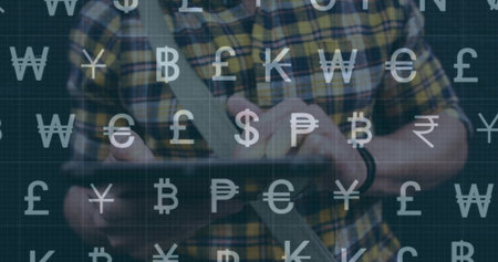 Tapping tablet, man wearing plaid shirt in dim room, with shoulder strap wristband currency overlay....