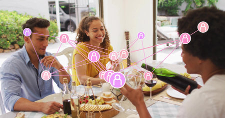 Pouring wine, man on right filling glass at home, yellow-topped woman, green bottle, pink overlay....