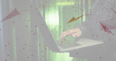 Typing on silver laptop, Korean man in server room in suit jacket, white shirt, red overlays....
