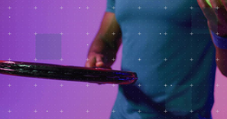 Holding racket rim, man wearing blue t-shirt gesturing at green ball with grid overlay in studio. Hoop, gradient, magenta, teal, lighting, shadow, poseの写真素材