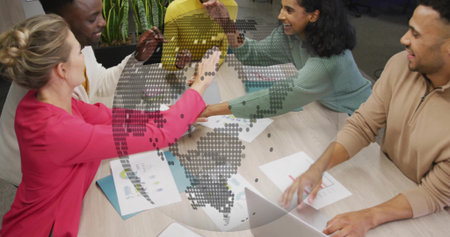 Joining five-person team in office wear leaning at meeting table placing hands over laptop, charts....