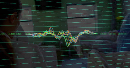 Displaying color chart on glass, tracking trends in dim office with labels and colleagues in shirts. Data, analytics, visualization, dashboard, meeting, collaboration, monitorsの写真素材