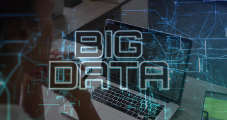 Showing laptop screen running code and data at desk, with smartphone, notepad, BIG DATA overlay. Holographic, circuit, network, analytics, visualization, monitor, programmingの写真素材