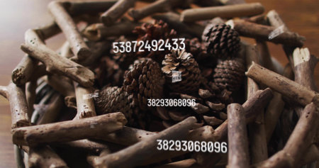 Displaying centered driftwood wreath holding aged pinecones on wooden table, with barcode watermark....